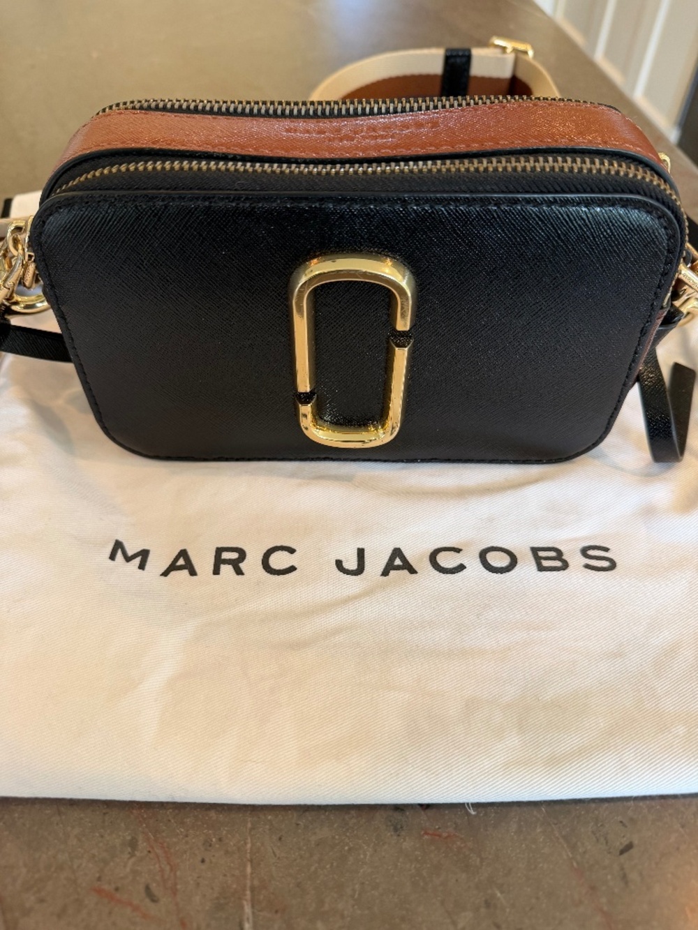 Marc Jacobs Camera Bag small crossbody handbag. Black with tan trim.